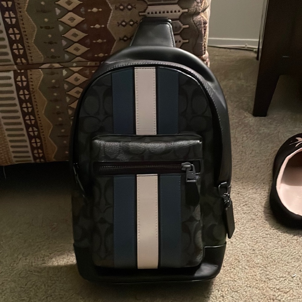 Like new condition coach West Pack In Signature Canvas With Varsity Stripe